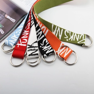 Set of colorful canvas belts with double D-ring buckles and white text print