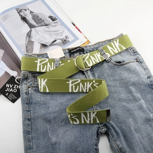Detail of green canvas belt with white graffiti print and double D-ring buckle closure