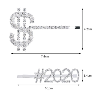 Detailed dimensions of silver rhinestone $ and #2020 hair clips on white background