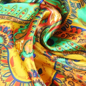 Golden paisley silk satin headscarf for women featuring bright floral ethnic patterns