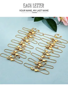 Adjustable gold plated stainless steel heart bracelet featuring alphabet initial charms