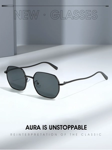 Detail of minimalist hexagonal metal sunglasses with deep gray lenses and slim black frames