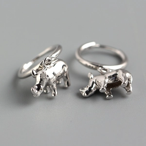 Detailed view of 3D geometric rhinoceros hoop earrings made of 925 sterling silver