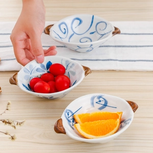 Ceramic bowls with dual handles and blue floral patterns for salad, fruit, and snacks