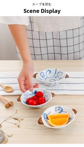 Ceramic bowl with double handles featuring blue vortex pattern for fruits or soup