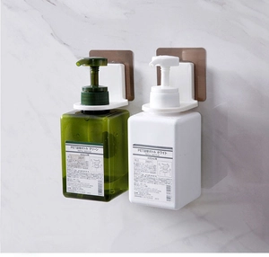 Wall-mounted no-drill bathroom holder with 400ml soap dispenser bottles on marble tile