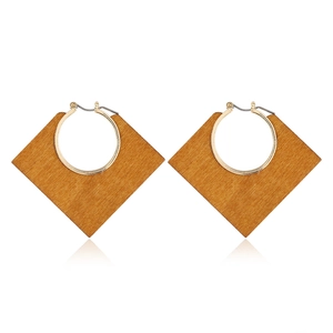 Classic geometric wooden rhombus drop earrings with golden metal loops on white background