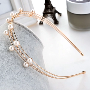 Elegant double-layered gold headband featuring white pearls and sparkling rhinestones
