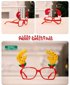 Detail view of festive Santa glasses with gold sequin antlers and holiday decorations