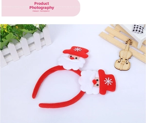 Detail of Christmas headband with double Santa Claus figures and red velvet finish