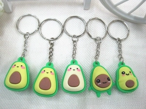 Detailed set of five cartoon avocado keychains with diverse cute facial expressions