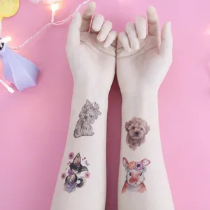 Cute cartoon animal tattoo stickers with watercolor dogs and rabbits on a girl's arm
