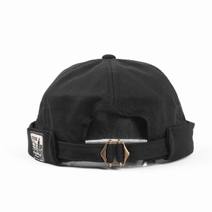 Detail of black cotton docker hat with adjustable bronze buckle and vintage textile label