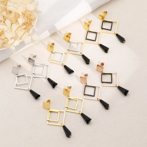 Long geometric titanium steel earrings with black conical pendants in gold and silver