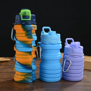 Three colorful collapsible silicone water bottles in various folded and expanded states