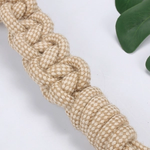Durable cotton rope chew toy for dogs with thick braided texture and natural beige fibers