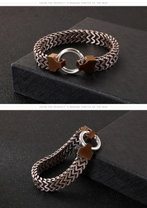 Detail of double-layer wheat chain men's bracelet in silver and bronze stainless steel