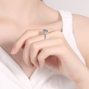 Elegant 925 sterling silver ring with 1 carat light blue moissanite and side stones