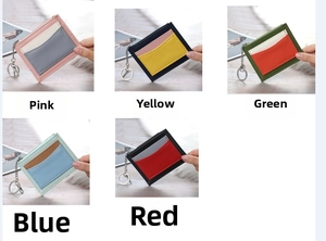 Close-up of multicolor patchwork leather coin purses with zipper and keychain detail