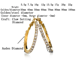 Chic oversized gold hoop earrings set with sparkling claw-set crystals on white background