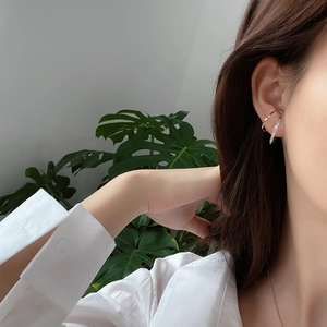 Minimalist 925 sterling silver double layer ear cuff with zircons on female model