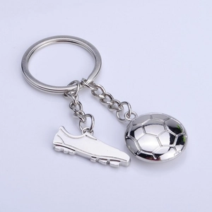 Detailed silver soccer keychain showing a miniature 3D ball and sports shoe pendant