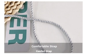 Close-up of silver braided twist shoulder strap with metallic texture and comfort design