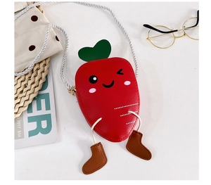 Detailed view of kids cute carrot crossbody bag with green leaves and decorative shoes