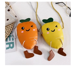 Detail of cute carrot mini crossbody bags with cartoon faces and small legs