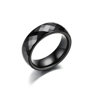 Polished black faceted ceramic ring with geometric diamond cut surface and comfort fit inner band