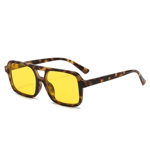 Retro pilot sunglasses with tortoiseshell frames and yellow lenses in a double bridge style