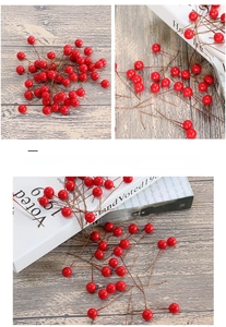 Detail of red faux holly berries with flexible wire stems for Christmas DIY decor