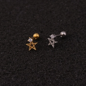 Macro shot of gold and silver star stud earrings with cubic zirconia and screw backs