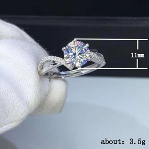 Silver rings set with 11mm round zircon and pavé twisted band held in hand