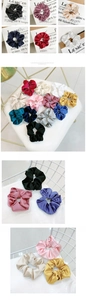 Detailed view of assorted colors and smooth satin texture of the large scrunchie set