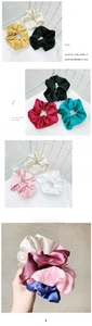 Detail shot of oversized satin scrunchies in multiple colors on a white mesh chair