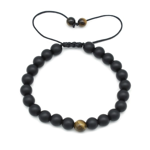 Detailed view of 8mm tiger eye and matte black beads with adjustable braided cord