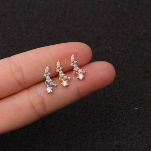 Macro view of flower zircon ear studs in silver, gold and rose gold stainless steel