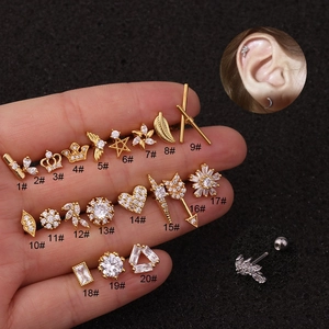 Assortiment de clous d'oreilles couronne et étoile dorés avec zircone pour piercing