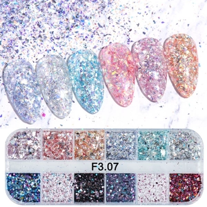 Macro view of 12-grid nail art glitter sequins set featuring mixed iridescent foil flakes