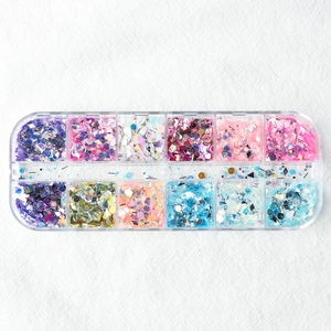 Top view of 12-grid storage box with colorful butterfly and heart shape nail art sequins