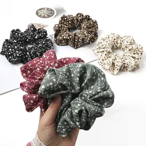 Set of five floral cotton scrunchies in diverse colors with high-elastic inner bands