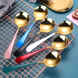 Detail of colorful handle spoons with golden stainless steel finish in elegant rack