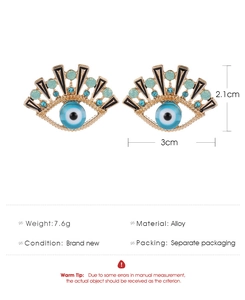 Detail view of blue evil eye earrings with dimensions and 7.6g weight specifications