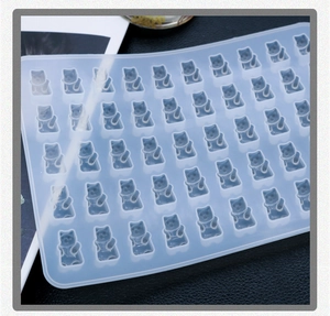 Detailed view of translucent silicone gummy bear mold with 50 cavities for DIY crafts