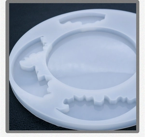 Macro shot of circular blue translucent silicone resin mold with wave textured grooves