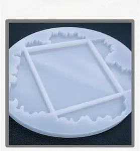 Close-up of a wavy round silicone mold for DIY resin coasters with rectangular frame detail