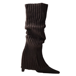 Detail of dark brown ribbed knit leg warmers showing texture and chunky winter style