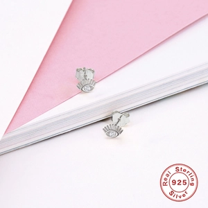 Macro detail of S925 sterling silver eye stud earring with a sparkling zircon inlay