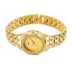 Detail shot of the gold square textured dial and crystal-encrusted bezel on this women's watch